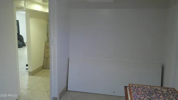 an aerial view of a house with a yard and swimming pool