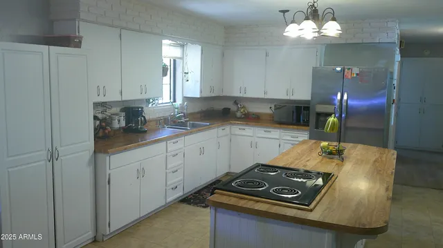 a view of a dining room with furniture and a window