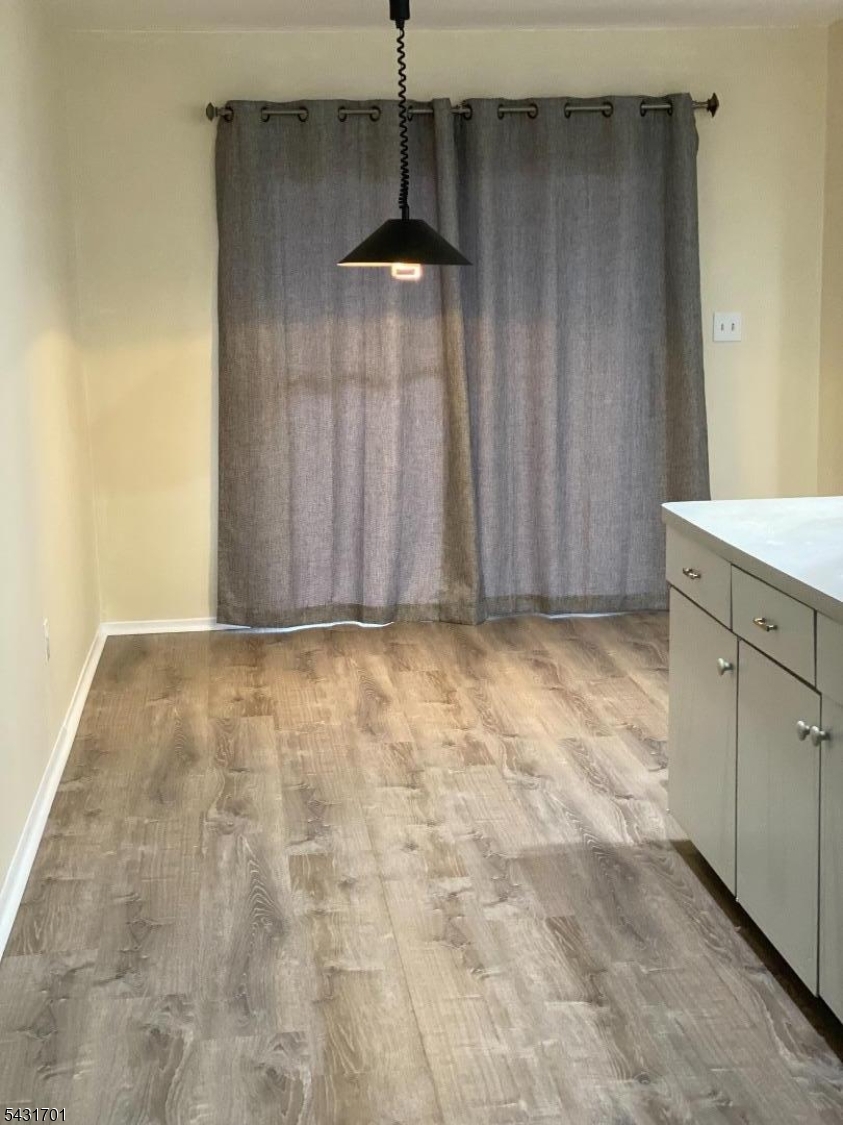 161 Evergreen Road, Unit 13A Edison, NJ 08837 - Photo 3 of 12 a view of an empty room with cabinet and a window