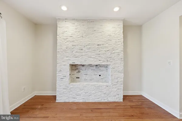 an empty room with wooden floor