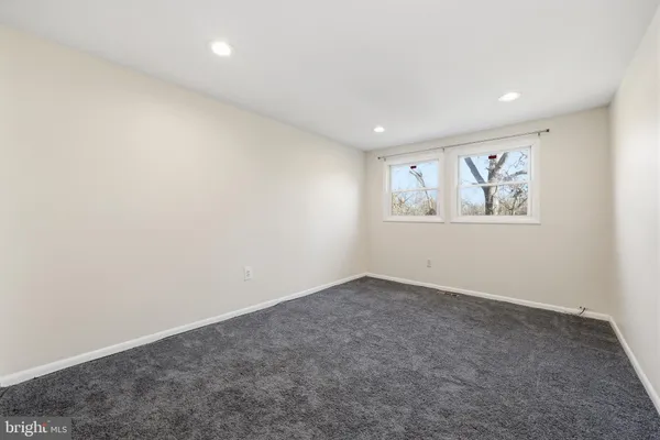 an empty room with closet area