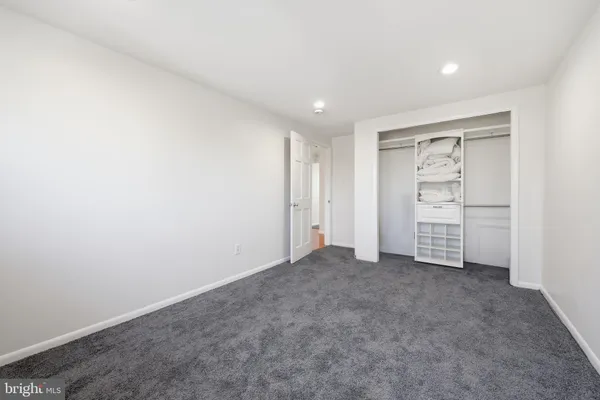 an empty room with a hallway