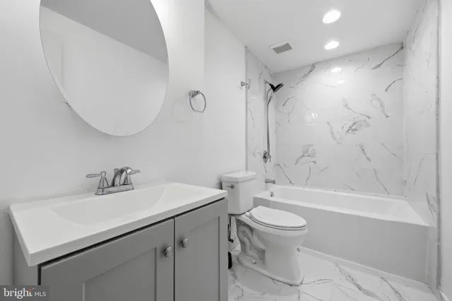 a view of a pathway with a wooden fence