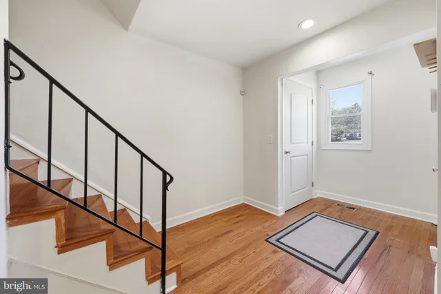 a view of an entryway with wooden floor
