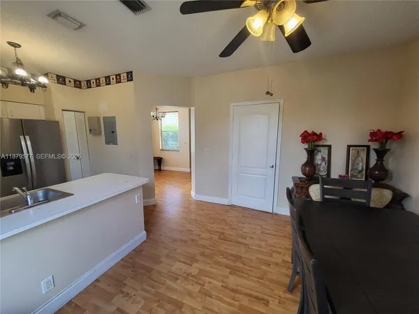 a view of a kitchen from the kitchen