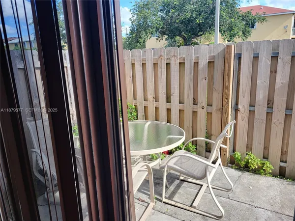 a wooden bench sitting in front of a door