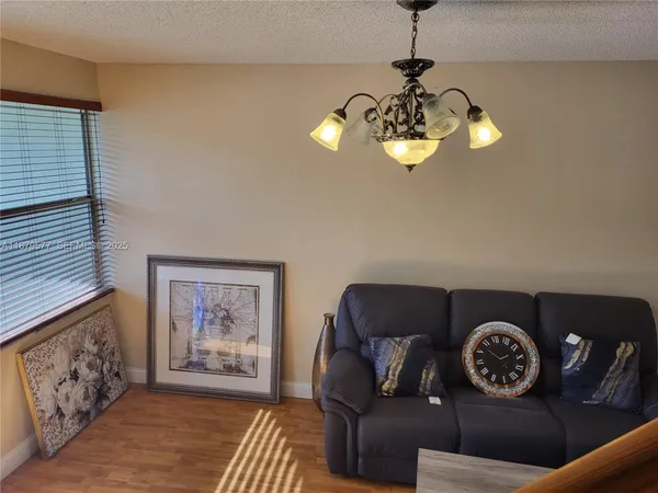 a view of a livingroom with furniture and wooden floor