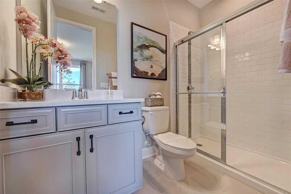 4192 Charlton Road Fort Mill, SC 29715 - Photo 30 of 36 a bathroom with a toilet a sink and a mirror