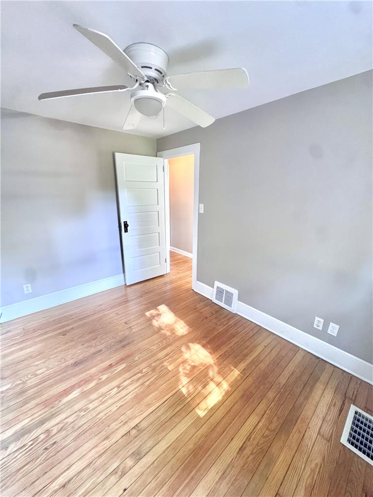 5454 Camp Meeting Road Center Valley, PA 18034 - Photo 16 of 27 Hardwood flooring extends throughout this well-lit room, complemented by a convenient ceiling fan.