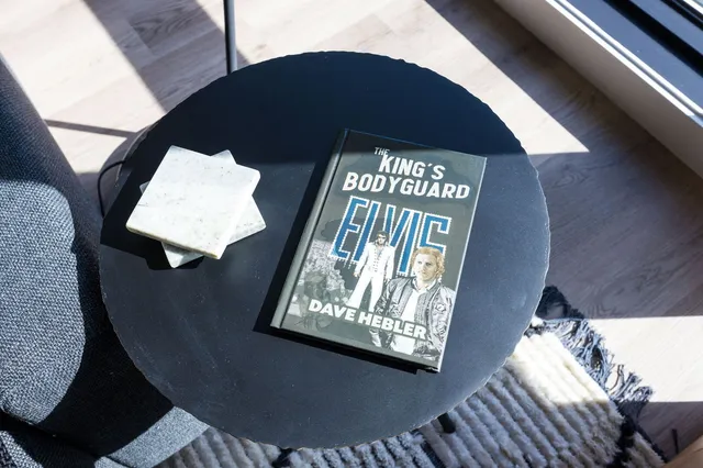 a kitchen with sink refrigerator and couches