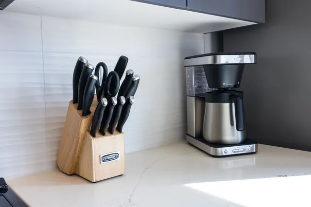 a large bedroom with a bed and large window
