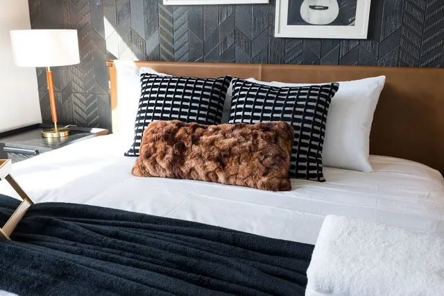 a bathroom with a double vanity sink toilet and mirror