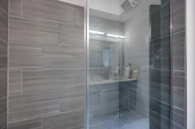 a bedroom with a bed and a lamp