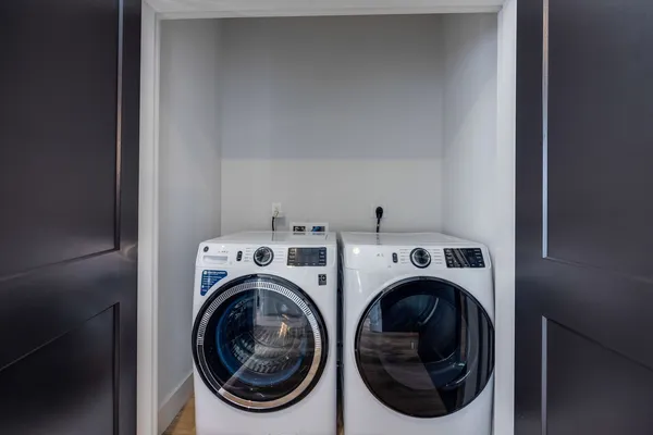 a view of a livingroom with furniture and a window
