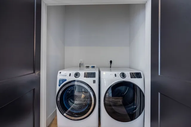 a view of a livingroom with furniture and a window