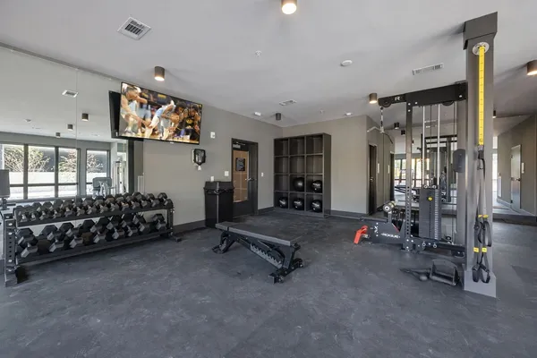 a view of gym equipment and windows