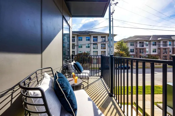 a view of a balcony with chairs