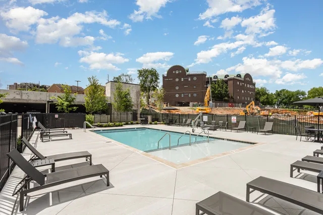 a view of a swimming pool with a lounge chairs