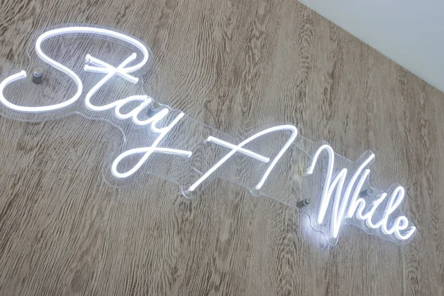 a bed room with furniture and wooden floor