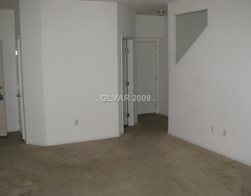8823 Roping Rodeo Avenue, Unit 102 Las Vegas, NV 89178 - Photo 4 of 8 Living Room.
