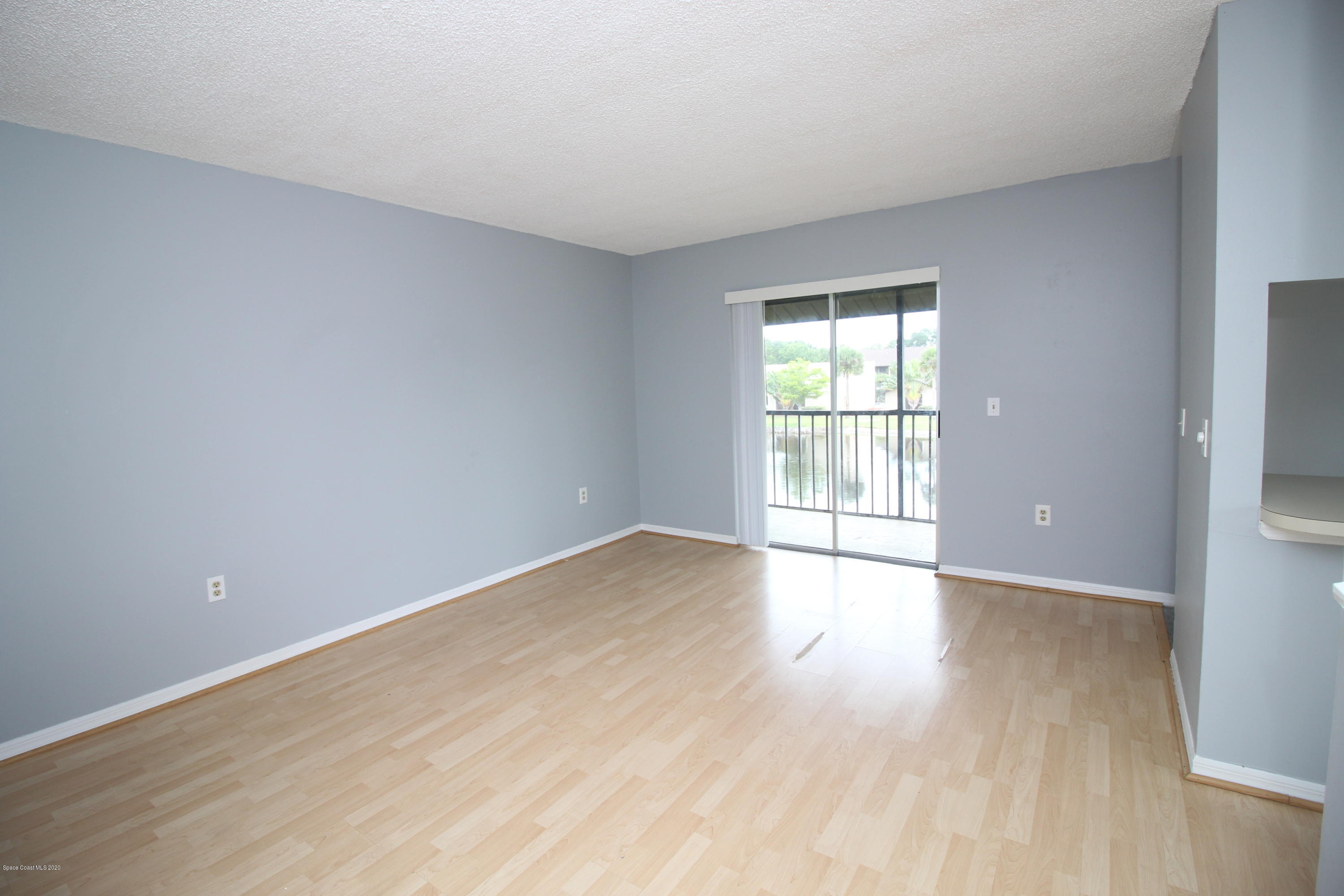 240 Spring Drive, Unit 12 Merritt Island, FL 32953 - Photo 2 of 14 Living - IMG_6477