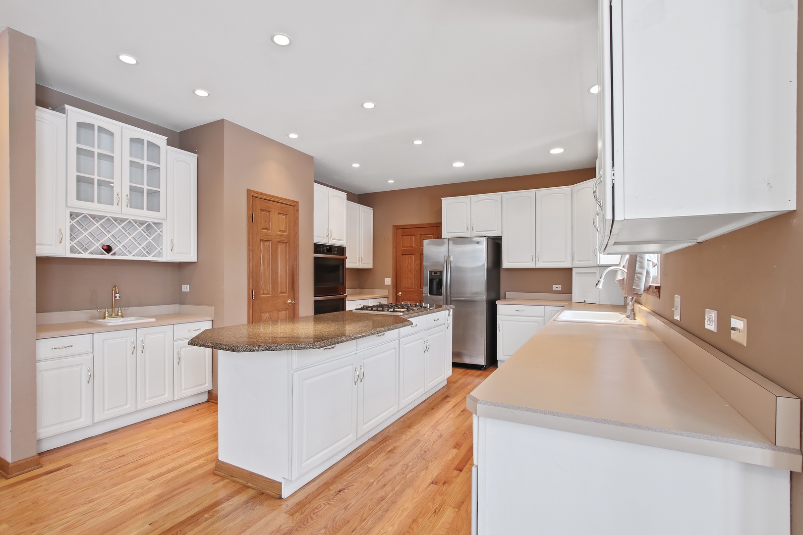 3111 Mini Drive Wadsworth, IL 60083 - Photo 5 of 17 a large kitchen with stainless steel appliances a large counter top a stove and a refrigerator