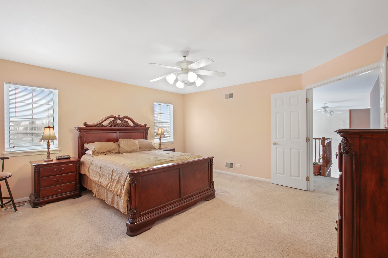 3111 Mini Drive Wadsworth, IL 60083 - Photo 8 of 17 a bedroom with a bed and a chandelier
