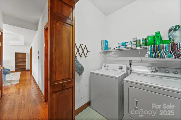 a view of storage and utility room with washer and dryer