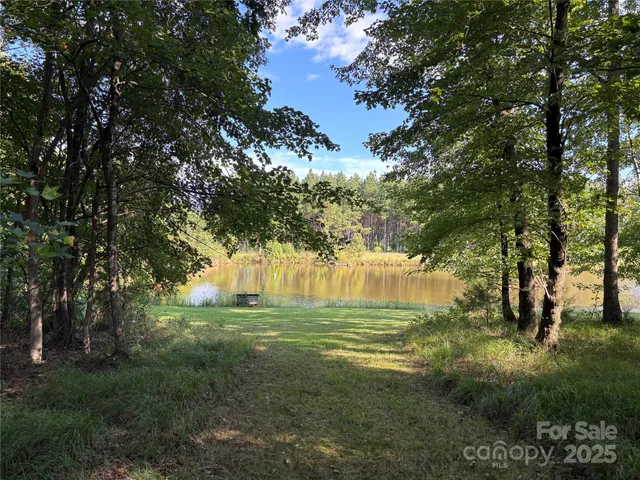 a view of a golf course with trees