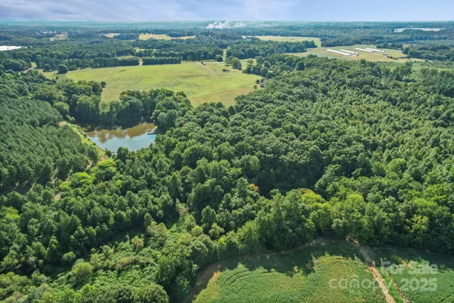 an aerial view of a houses with a lake view
