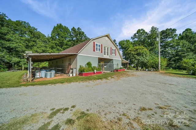 a view of house with outdoor space and porch