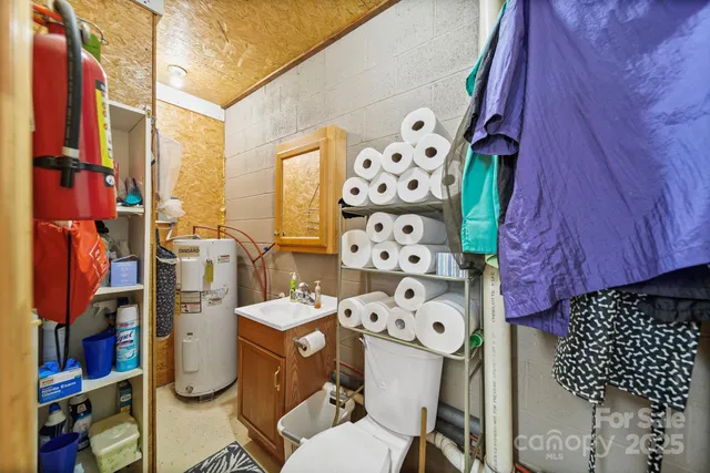 a utility room with multiple dryer and washer