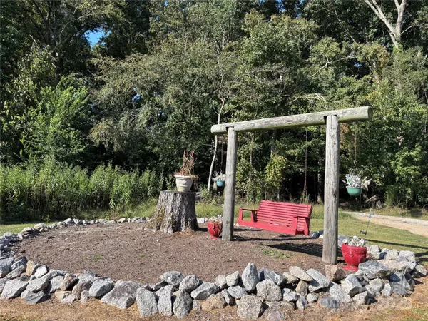 a view of a park with iron fence