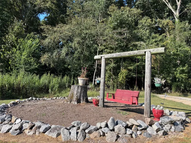 a view of a park with iron fence