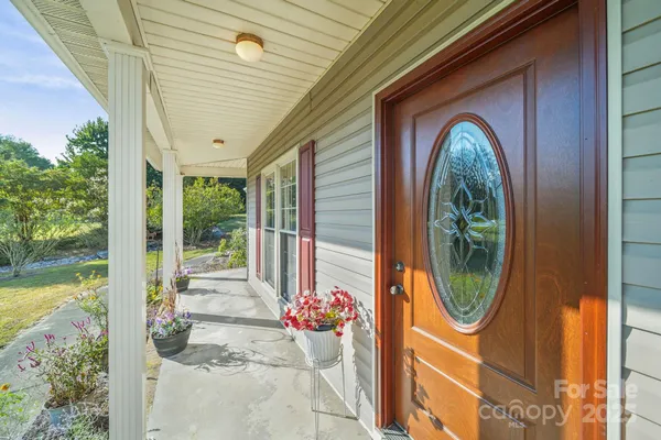 a view of a two chairs in the balcony
