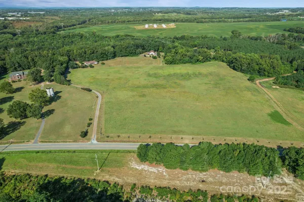 a view of a field with an ocean