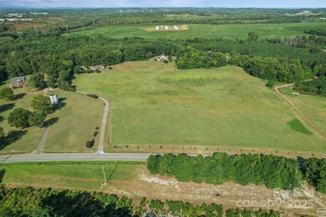 a view of a field with an ocean