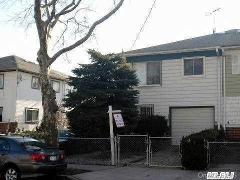 155-46 114th Road Queens, NY 11434 - Photo 1 of 1 a front view of a house with parking