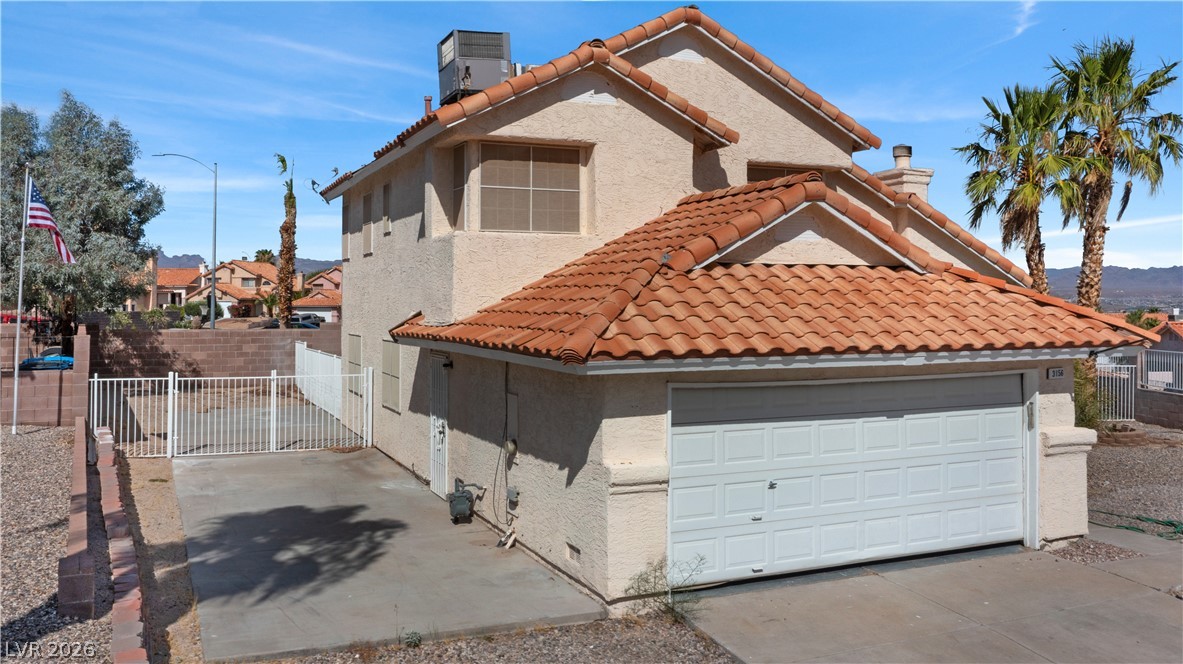 3156 Terrace View Drive Laughlin, NV 89029 - Photo 75 of 94 A terracotta tile roof adorns this home with an integrated garage and scenic desert mountain views.