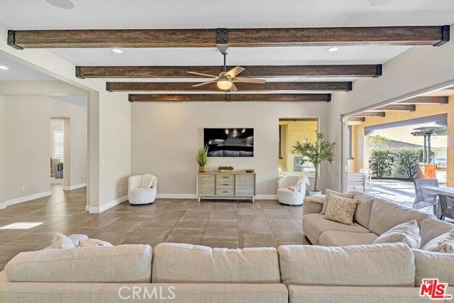 446 Via Maggiore Chula Vista, CA 91914 - Photo 23 of 30 a living room with furniture and a chandelier