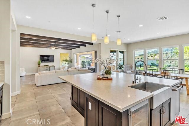 446 Via Maggiore Chula Vista, CA 91914 - Photo 25 of 30 a kitchen with granite countertop a sink a counter top space appliances and cabinets