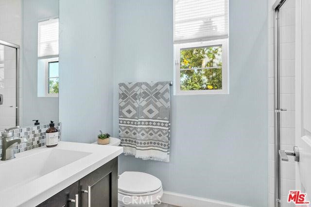 446 Via Maggiore Chula Vista, CA 91914 - Photo 6 of 30 a bathroom with a sink a toilet and shower