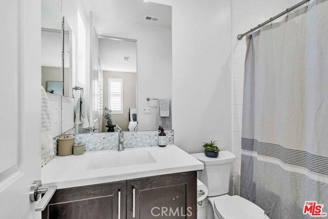 446 Via Maggiore Chula Vista, CA 91914 - Photo 7 of 30 a bathroom with a sink a toilet and shower