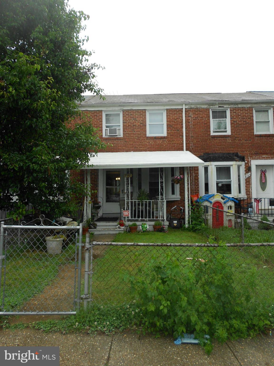 8162 Kavanagh Road Dundalk, MD 21222 - Photo 1 of 5 a front view of a house with a yard