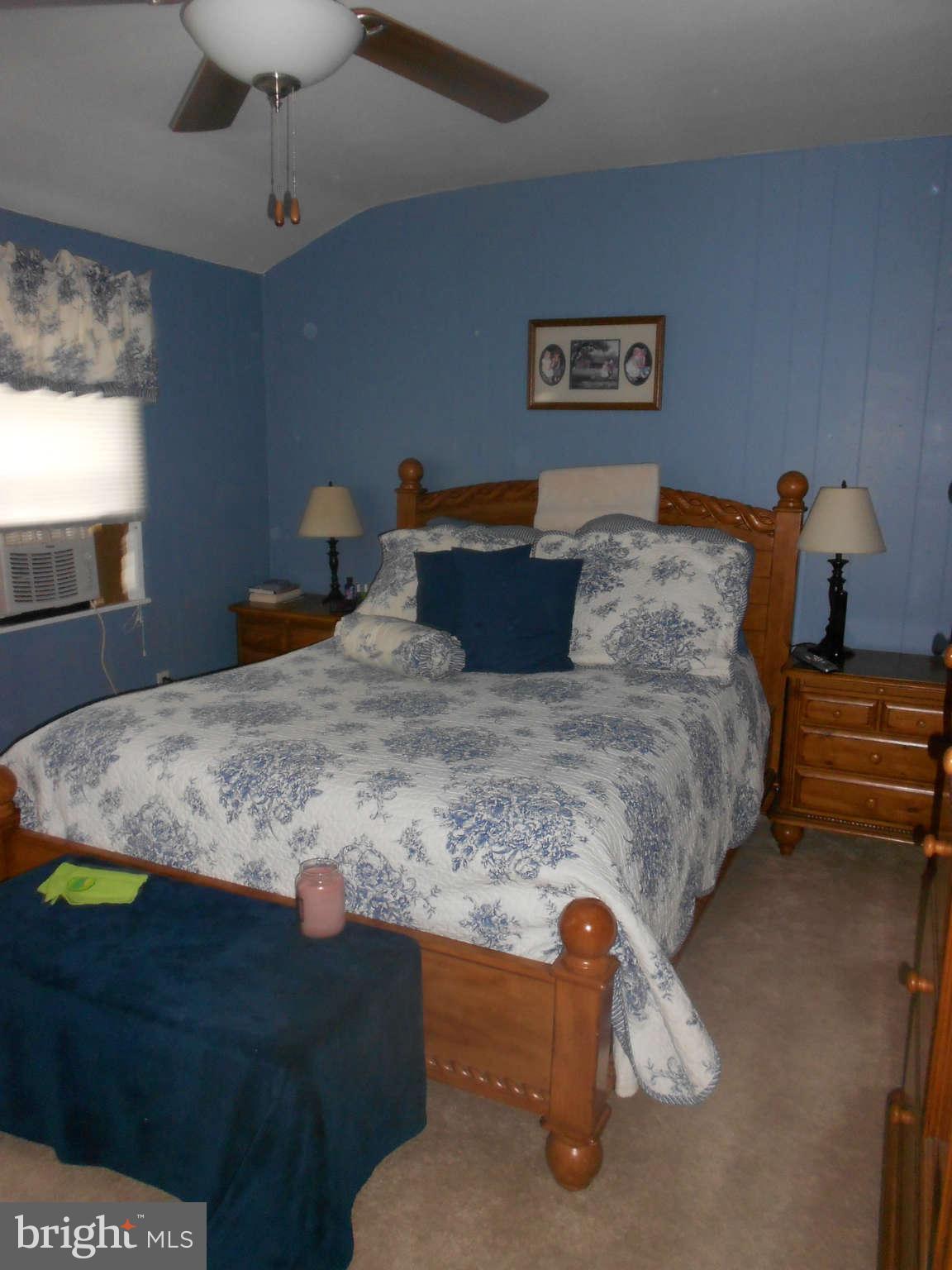 8162 Kavanagh Road Dundalk, MD 21222 - Photo 4 of 5 a bedroom with bed and window