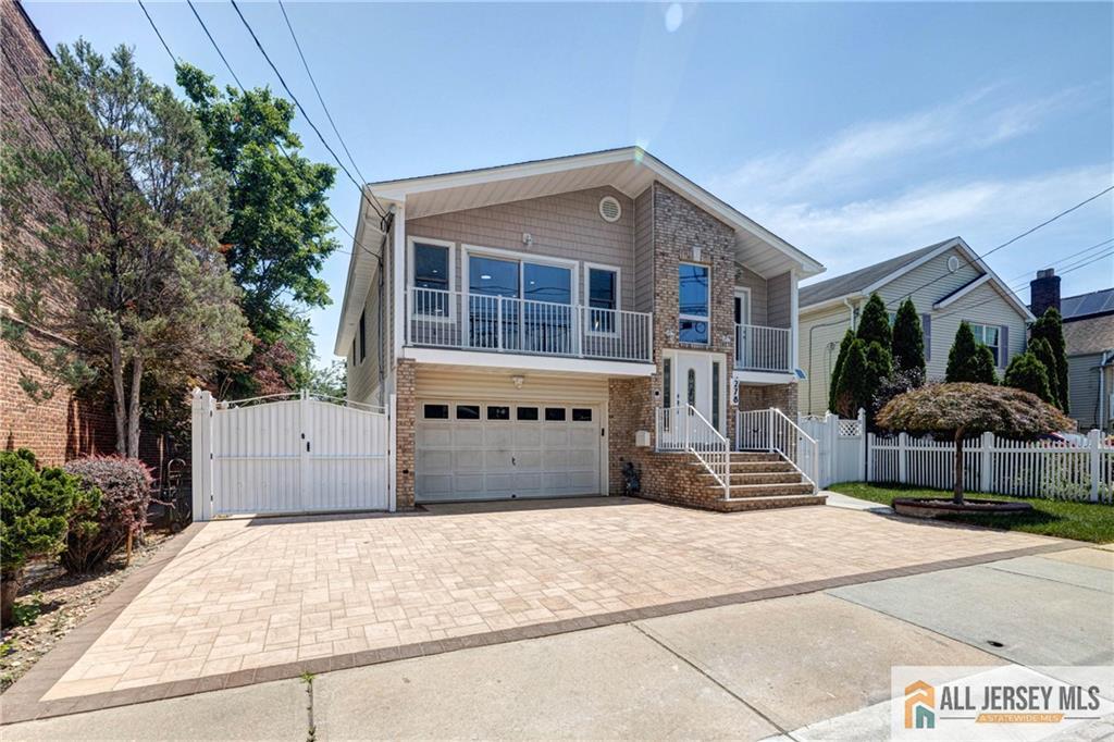 278 Rector Street Perth Amboy, NJ 08861 - Photo 4 of 47 a front view of a house with garage