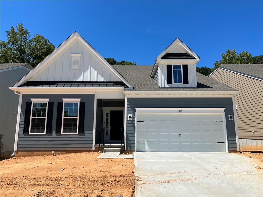 3155 Windhaven Lane, Unit 80 Tega Cay, SC 29708 - Photo 1 of 28 a front view of a house with a yard