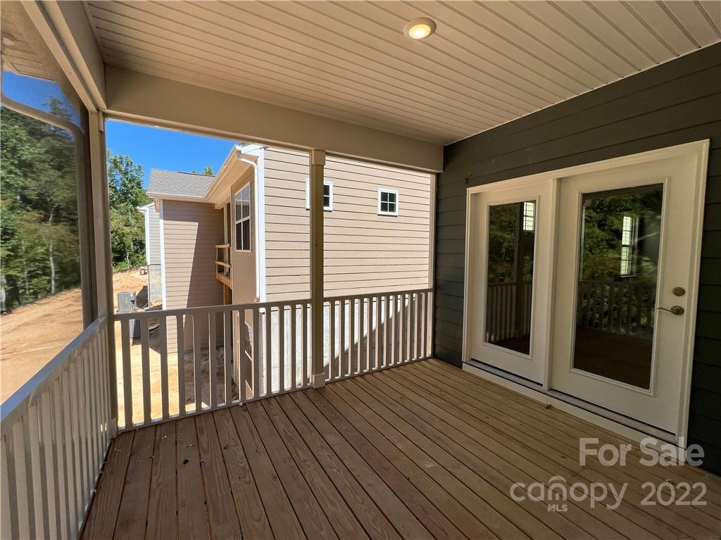 3155 Windhaven Lane, Unit 80 Tega Cay, SC 29708 - Photo 23 of 28 a view of a balcony with wooden floor