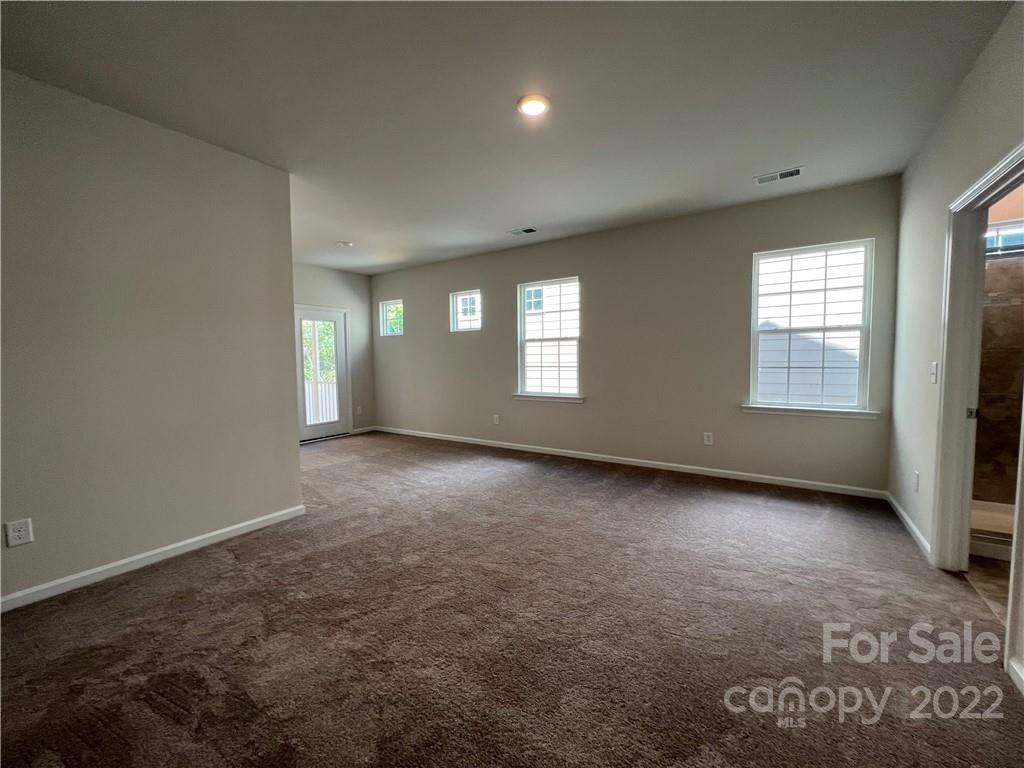 3155 Windhaven Lane, Unit 80 Tega Cay, SC 29708 - Photo 8 of 28 an empty room with windows