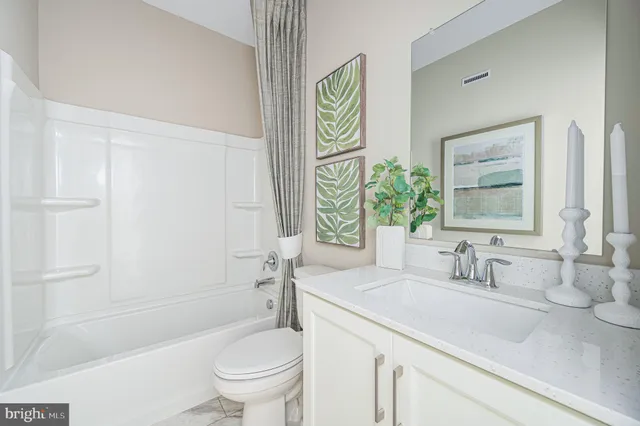 a bathroom with a sink a toilet and a bathtub